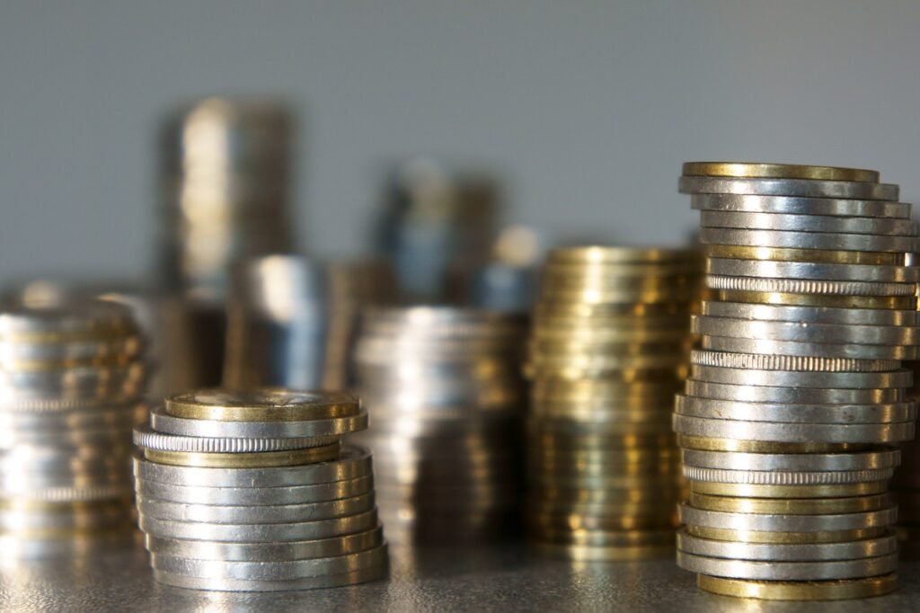 bunch of coins on table indicating wealth 